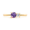 Greenwich ring featuring one 4 mm faceted round cut amethyst and one 2.1 mm diamond prong set in 14k gold - front view