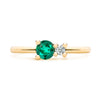 Greenwich ring featuring one 4 mm faceted round cut emerald and one 2.1 mm diamond prong set in 14k gold - front view