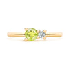 Greenwich ring featuring one 4 mm faceted round cut peridot and one 2.1 mm diamond prong set in 14k gold - front view