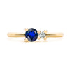 Greenwich ring featuring one 4 mm faceted round cut sapphire and one 2.1 mm diamond prong set in 14k gold - front view