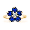 Greenwich ring featuring five 4 mm faceted round cut sapphires and one 2.1 mm diamond prong set in 14k gold - front view