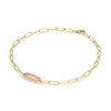 14k yellow gold Adelaide paperclip chain bracelet featuring one link encrusted with 1.5 mm pavé pink sapphires - angled view