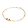 14k yellow gold Adelaide paperclip chain bracelet featuring one link encrusted with 1.5 mm pavé sapphires - angled view