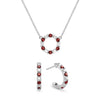 White gold Rosecliff small open circle necklace and huggie earrings featuring alternating 2 mm round cut diamonds & garnets