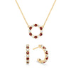 Gold Rosecliff small open circle necklace and huggie earrings featuring alternating 2 mm diamonds & garnets - front view