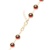 14k yellow gold 1.17 mm cable chain with a lobster claw clasp and 6 mm briolette cut bezel set garnets