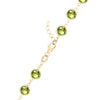 14k yellow gold 1.17 mm cable chain with a lobster claw clasp and 6 mm briolette cut bezel set Peridots