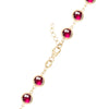 14k yellow gold 1.17 mm cable chain with a lobster claw clasp and 6 mm briolette cut bezel set rubies