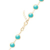 14k yellow gold 1.17 mm cable chain with a lobster claw clasp and 6 mm briolette cut bezel set turquoises