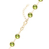 14k yellow gold 1.17 mm cable chain with a lobster claw clasp and 6 mm briolette cut bezel set peridots