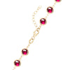 14k yellow gold 1.17 mm cable chain with a lobster claw clasp and 6 mm briolette cut bezel set rubies