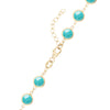 14k yellow gold 1.17 mm cable chain with a lobster claw clasp and 6 mm briolette cut bezel set turquoises