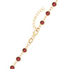 14k yellow gold 1.17 mm cable chain with a lobster claw clasp and 4 mm briolette cut bezel set garnets