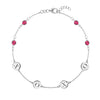 14k white gold cable chain bracelet featuring four rubies and four 1/4” flat engraved letter discs, spelling XOXO