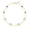 14k gold cable chain bracelet featuring four rubies and four 1/4” flat engraved letter discs, spelling XOXO - front view