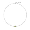 Classic cable chain bracelet featuring one 4 mm briolette cut peridot bezel set in 14k white gold