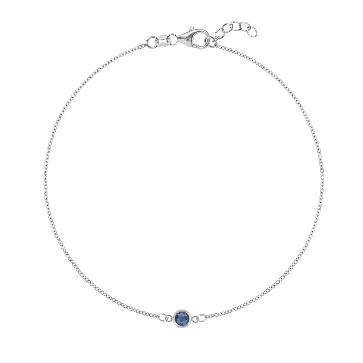 Classic cable chain bracelet featuring one 4 mm briolette cut sapphire bezel set in 14k white gold