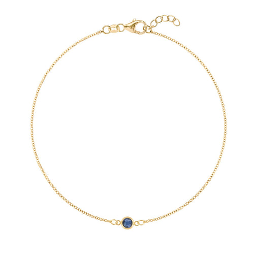 Classic cable chain bracelet featuring one 4 mm briolette cut sapphire bezel set in 14k yellow gold - front view