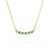 Rosecliff bar necklace with eleven alternating 2 mm round cut emeralds and diamonds prong set in 14k gold - angled view