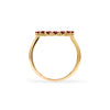 Rosecliff open circle ring featuring 2 mm faceted round cut garnets prong set in 14k yellow gold - standing view