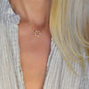 Woman with a Rosecliff small open circle necklace with twelve alternating 2 mm citrines & diamonds prong set in 14k gold