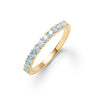 Rosecliff stackable ring featuring eleven 2 mm faceted round cut Nantucket blue topaz prong set in 14k gold - front view