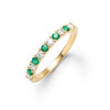 Rosecliff stackable ring featuring eleven alternating 2mm emeralds and diamonds prong set in 14k yellow gold - front view