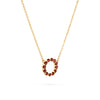 Rosecliff small circle necklace featuring twelve 2mm faceted round cut garnets prong set in 14k yellow gold - angled view