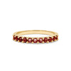Rosecliff stackable ring featuring eleven 2 mm faceted round cut garnets prong set in 14k yellow gold