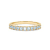 Rosecliff stackable ring featuring eleven 2 mm faceted round cut Nantucket blue topaz prong set in 14k yellow gold