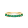 Rosecliff stackable ring featuring eleven 2 mm faceted round cut emeralds prong set in 14k yellow gold
