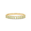 Rosecliff stackable ring featuring eleven 2 mm faceted round cut peridots prong set in 14k yellow gold