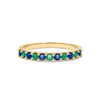 Rosecliff stackable ring featuring eleven alternating 2 mm faceted round cut sapphires and emeralds prong set in 14k gold