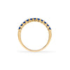 Rosecliff stackable ring featuring eleven 2 mm faceted round cut sapphires prong set in 14k yellow gold - standing view