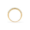 Rosecliff stackable ring featuring eleven 2 mm faceted round cut aquamarines prong set in 14k yellow gold - standing view