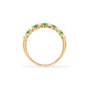 Rosecliff stackable ring featuring eleven alternating 2mm emeralds and diamonds prong set in 14k yellow gold - standing view