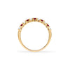 Rosecliff stackable ring featuring eleven alternating 2mm garnets and diamonds prong set in 14k yellow gold - standing view