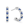 Two Rosecliff huggie earrings in 14k white gold each featuring nine alternating 2mm round cut sapphires and diamonds