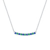 Rosecliff bar necklace with eleven alternating 2 mm faceted round cut emeralds and sapphires prong set in 14k white gold