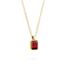 Adelaide paper clip chain and a Warren pendant with an emerald cut bezel set garnet gemstone in 14k gold - angled view