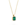 Adelaide paper clip chain and a Warren pendant with an emerald cut bezel set emerald gemstone in 14k gold - angled view