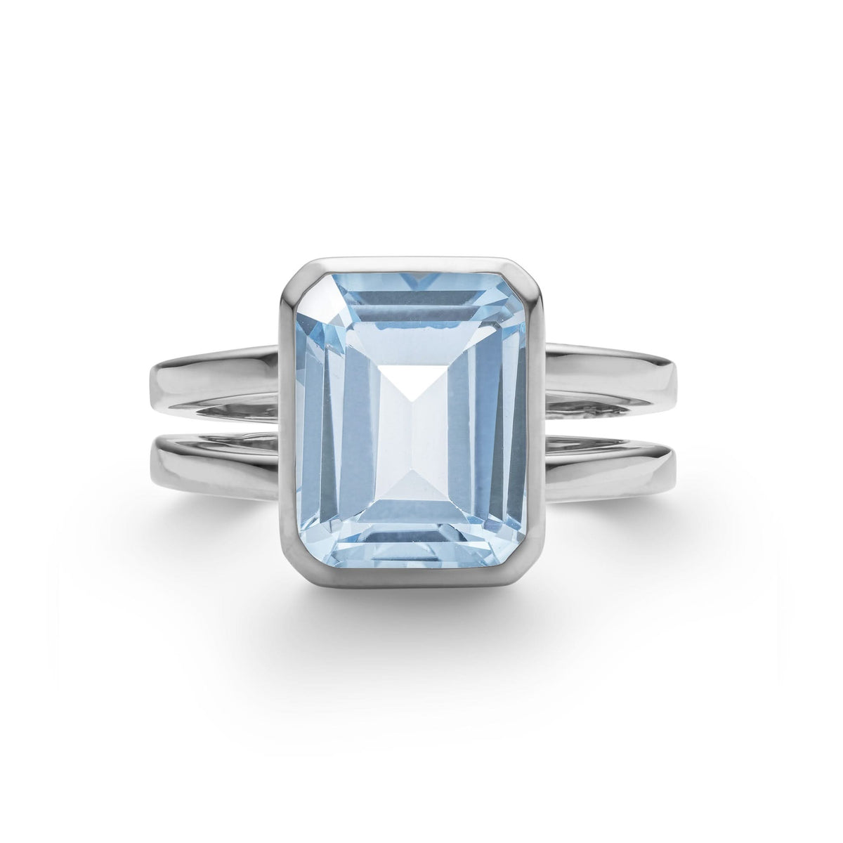 Warren ring in 14k white gold featuring one 10 x 8 mm emerald cut bezel set aquamarine - front view