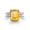 Warren ring in 14k white gold featuring one 10 x 8 mm emerald cut bezel set citrine - front view