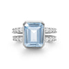 Warren ring in 14k white gold with accent diamonds featuring one 10 x 8 mm emerald cut bezel set aquamarine - front view