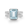 Warren ring in 14k white gold with accent diamonds featuring one 10 x 8 mm emerald cut Nantucket blue topaz - front view