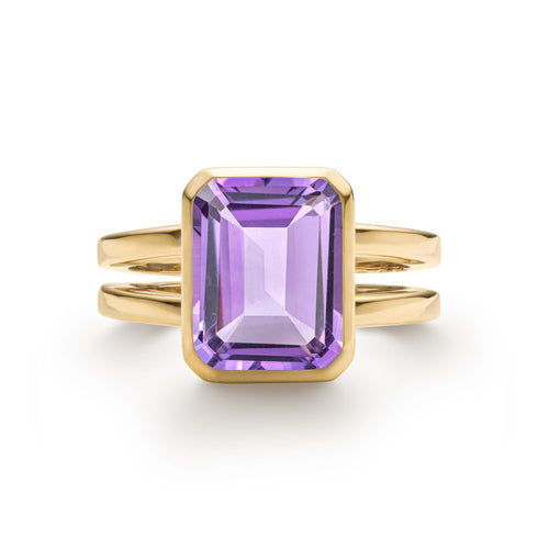 Warren ring in 14k yellow gold featuring one 10 x 8 mm emerald cut bezel set amethyst - front view