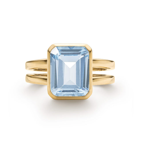 Warren ring in 14k yellow gold featuring one 10 x 8 mm emerald cut bezel set aquamarine - front view