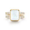 Warren ring in 14k gold with accent diamonds featuring one 10 x 8 mm emerald cut bezel set rainbow moonstone - front view