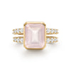 Warren ring in 14k yellow gold with accent diamonds featuring one 10 x 8 mm emerald cut bezel set rose quartz - front view
