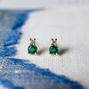 Pair of 14k yellow gold Greenwich 1 Birthstone earrings each featuring one 4 mm round cut emerald and one 2.1 mm diamond